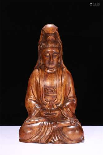 A Chinese Carved Huanghuali Figure of Buddha