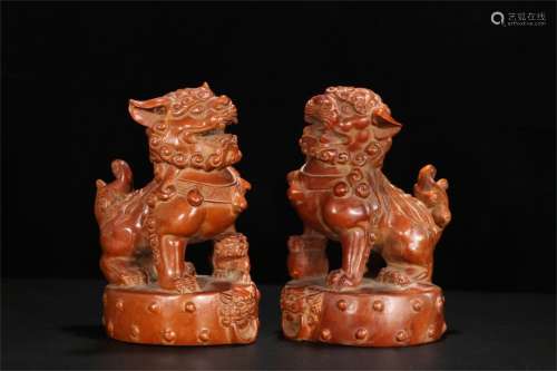 A Pair of Chinese Carved Boxwood Foo-Dog Decorations