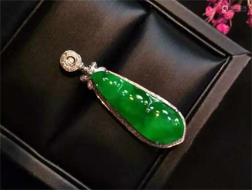 A Chinese Carved Jadeite Pendant