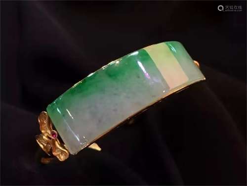 A Chinese Carved Jadeite Bracelet