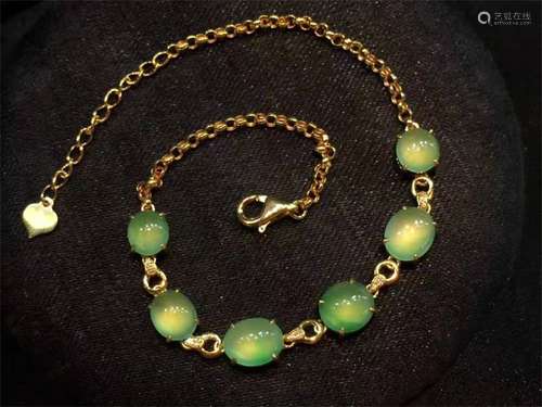 A Chinese Carved Jadeite Bracelet