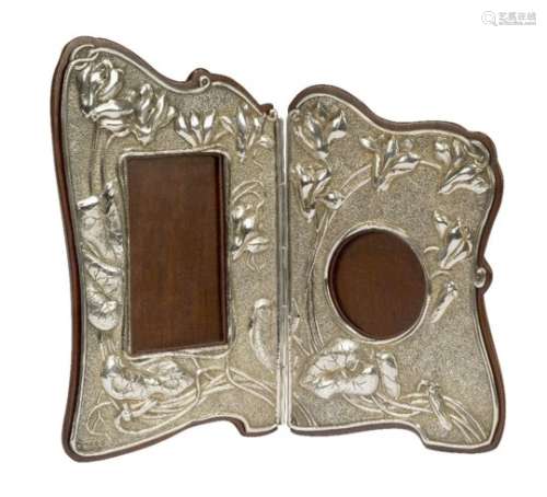 An Art Nouveau 'Japanesque' silver and mahogany hinged double photograph frame Mark of E. Mander &