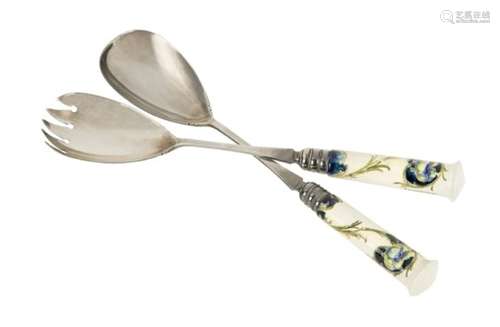 Moorcroft Macintyre, a pair of Florian ware 'Poppy' pattern ceramic and silvered metal salad servers