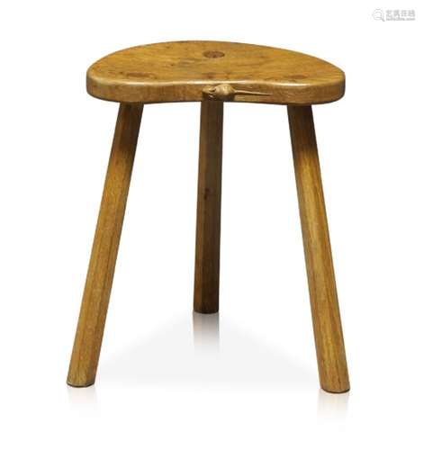 Robert Thompson (1876-1955), a ‘Mouseman’ English oak three-legged stool c.1970, signed with a