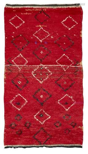 Moroccan, a handwoven long pile wool rug Second quarter 20th century Woven with irregular stylised