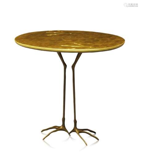 After Meret Oppenheim, a 'Traccia' table, designed 1939 c.1980 the oval giltwood top, on cast bronze