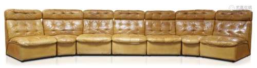 De Sede, a seven section brown leather sofa c.1970 with five centre sections and two corner sections