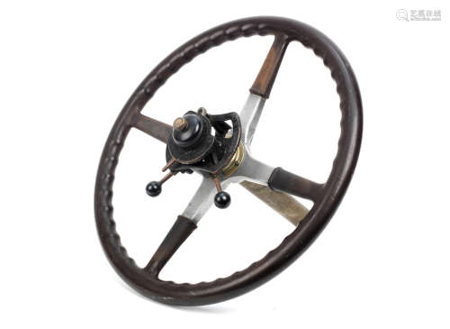 An Edwardian four-spoke steering wheel,