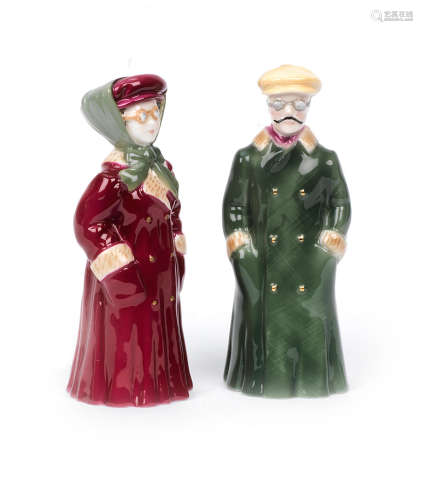 A pair of glazed ceramic 'The Motorist' candle snuffers by Royal Worcester,