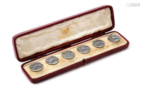 An Edwardian cased set of six 'Renault' sterling silver blazer buttons by Alfred Wigley of Birmingham, 1902,