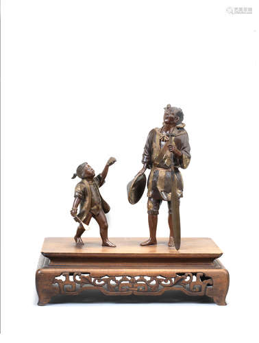 A partially gilt-bronze group of a cormorant fisherman and a boy   Style of Miyao Eisuke of Yokohama, Meiji era (1868-1912), late 19th/early 20th century