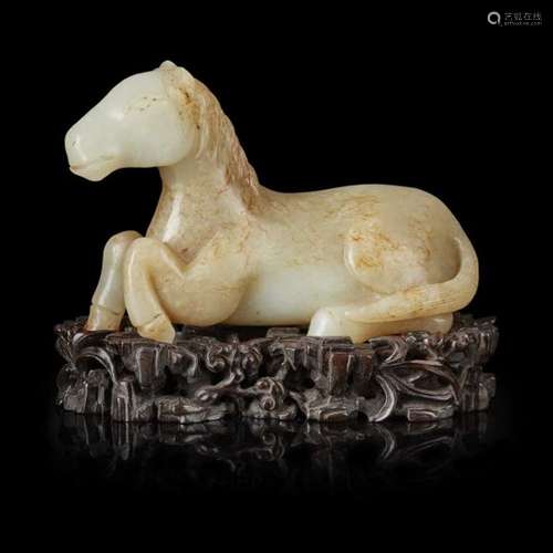 PALE CELADON AND RUSSET JADE CARVING OF A HORSE QING DYNASTY OR LATER