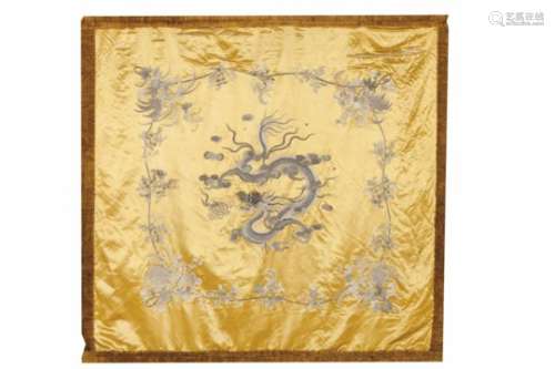 A textile panelSilkEmbroidered raised decoration with central five claw dragon in pursuit of the