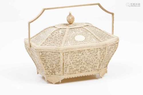 A basket with coverPierced and low relief ivory of flower and foliage scroll motifs, figures,