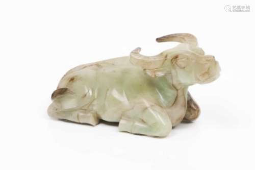 A water buffaloCeladon green jade sculpture with some brown markingsResting water buffaloChina, Qing