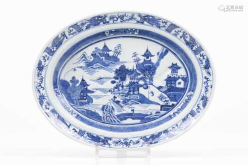 A fish trayChinese export porcelainBlue underglaze decoration with riverscape and pagodaQing
