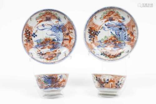 A pair of cups and saucersChinese export porcelainBlue underglaze decoration depicting lake view