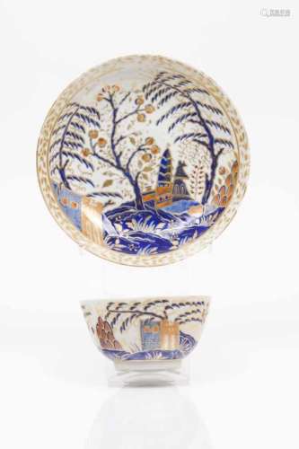 A cup and saucerChinese export porcelain Blue, pink, salmon and gilt decoration with buildings,