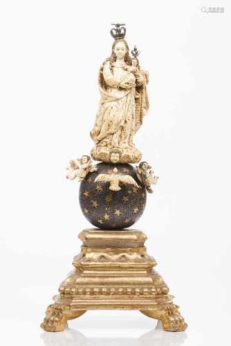 The Virgin Mary and ChildIndo-Portuguese ivory sculptureOn a starred blue painted and gilt wooden