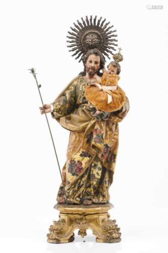 Saint Joseph and ChildPainted and gilt wooden sculptureSilver radiant halo and staff Portugal,