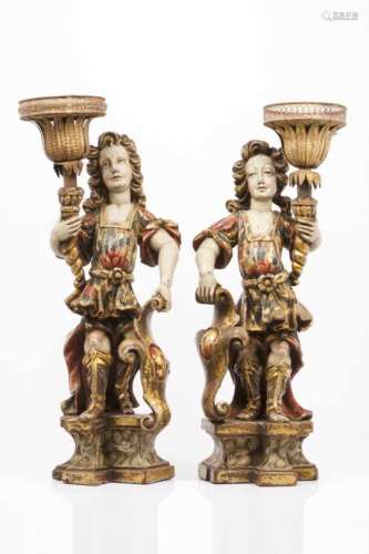 A pair of candl holder angelsBaroque polychrome wooden sculptures on marbled and gilt