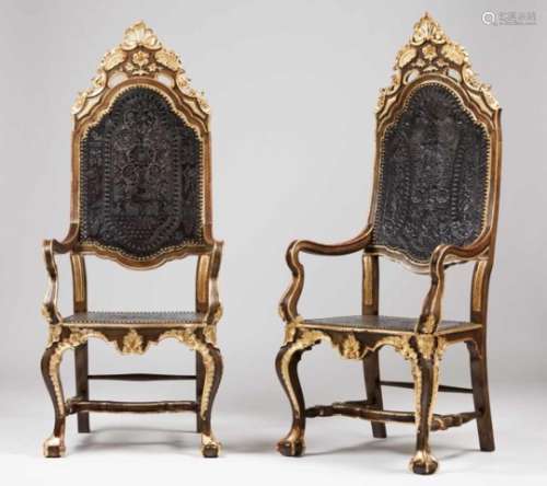A pair of D.João V armchairsCarved and gilt woodCraved leather backs and seats decorated with