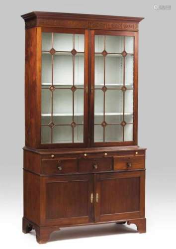 A D.Maria cupboardBrazilian rosewoodUpper section with two glazed drawers topped up by scrolled,
