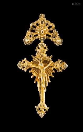 A crucifixGold, 19th centuryRaised flower and foliage decorationCrucified Christ with radiant
