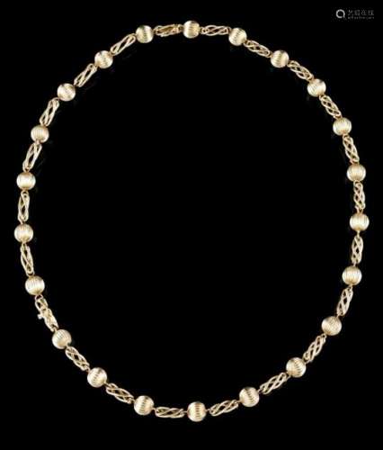 A necklaceGoldFluted beads and twisted thread linksGerman assay marks 585/00020th centuryLenght: