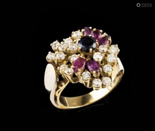 A ringGoldPlain band of stylised flower top set with 5 marquise cut rubies, a round cut sapphire and