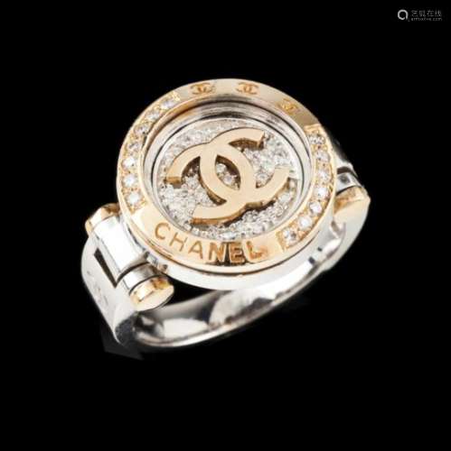 A Chanel ringBicoloured goldCentre and frame set with small brilliant cut diamonds and 