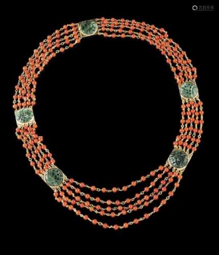 A necklaceGold, coral and jadeiteFour strands of coral beads chained in gold with 5 gold elements