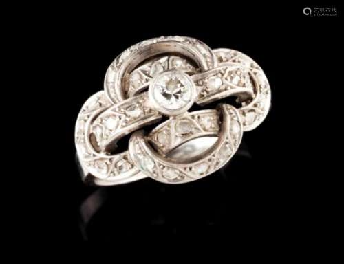 An Art Deco ringPlatinumPlain band toped by linked geometric motifs, set with small rose cut