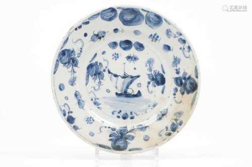 A plateDelft faienceBlue decoration with ship and flower and foliage motifs to lipMarked 