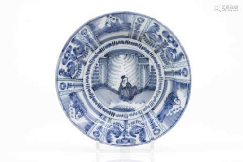 A deep plateDelft faienceBlue Wanli style decoration with chinese figure in the centre and segmented