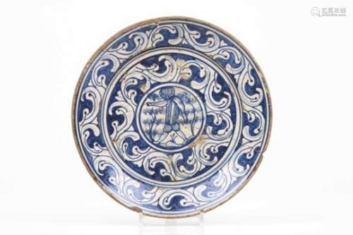 A plateFaienceBlue and manganese decoration with double baroque band and central figurePortugal,