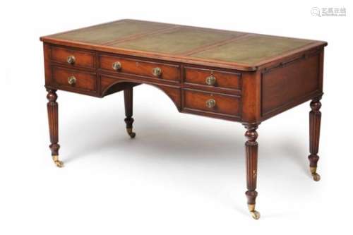A William IV deskWlnut and walnut veneeredGreen leather and gilt writing topsFive drawers and