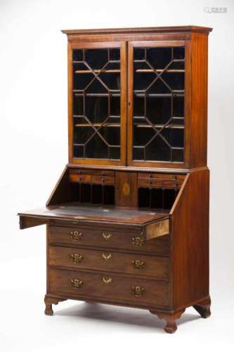 A bureau bookcaseMahogany and veneered in burr mahoganyFour long drawersGlazed doorsInner bureau