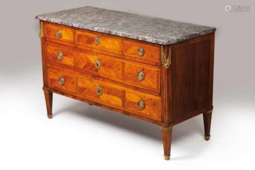 A Louis XVI commodeRosewood veneered and decorated with satinwood and other timbers marquetryGilt