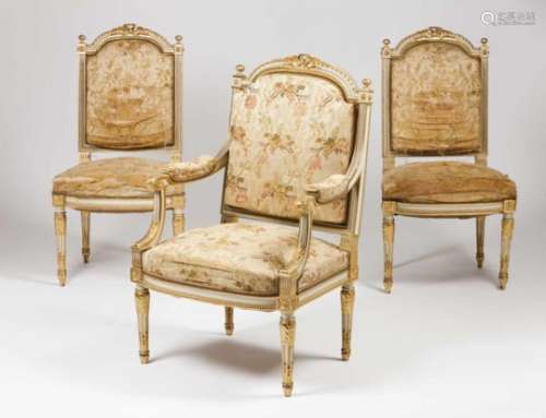 A pair of Louis XVI style chairs and an armchairPart carved, gilt and lacquered woodFlower patterned