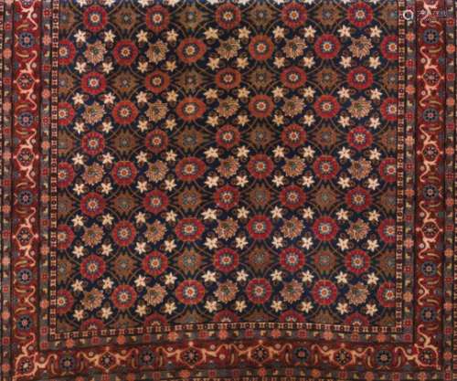 A Varamin rug, IranWool and cotton of floral and geometric design in bordeaux, blue and beige330x212
