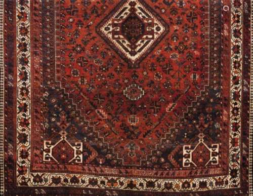 A Kashki rug, IranWool and cotton of geometric and floral design in bordeaux, beige and
