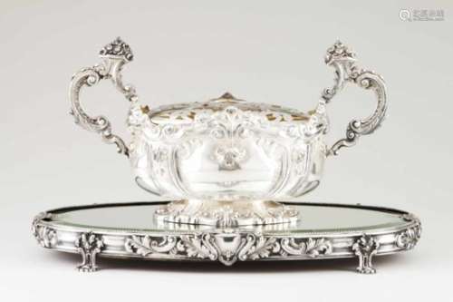 A centrepiece with flower bowlPortuguese silver Oval bowl of raised and chiselled decoration with