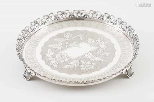 A galleried salver on feetPortuguese silverChiselled base profusely decorated with flowers and