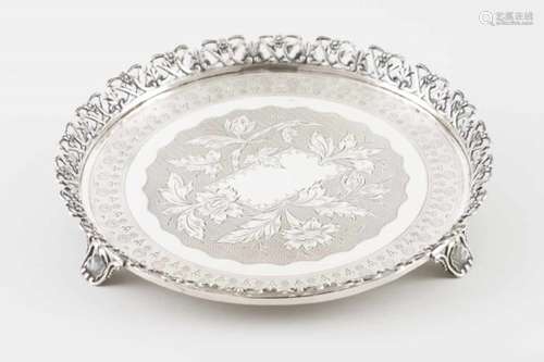 A galleried salver on feetPortuguese silverChiselled base profusely decorated with flowers and