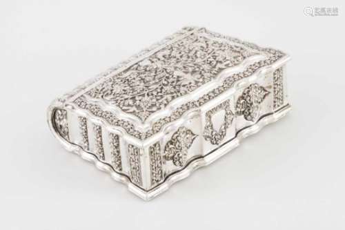 A boxIndian silverBook shaped with hinged cover profusely decorated with floral and foliage