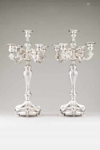 A pair of large five branch candelabraSpanish silver, 19th centuryBaroque style decoration of volute
