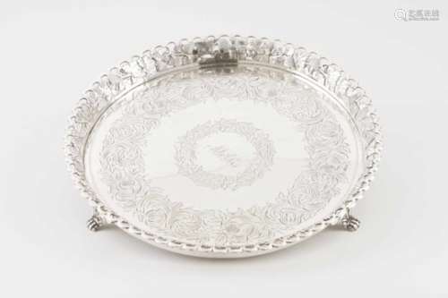 A galleried salver with feetPortuguese silverFlower motifs chiselled base with central monogram