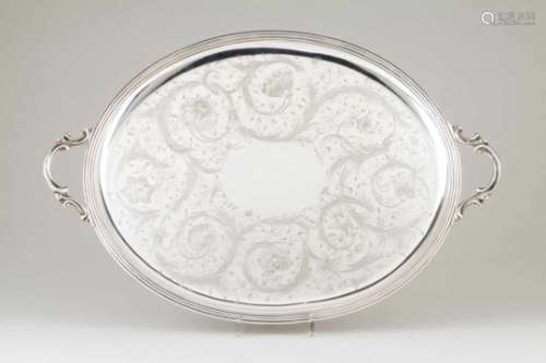 A large trayChristofleFlower and foliage engraved oval baseScroll handles43x64 cm- - -15.00 %