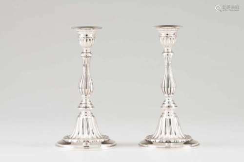 A pair of candlesticksPortuguese silverTurned and striated shaft ending on a circular fluted